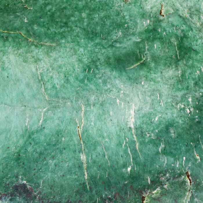 Een stukje groene Jade steen.